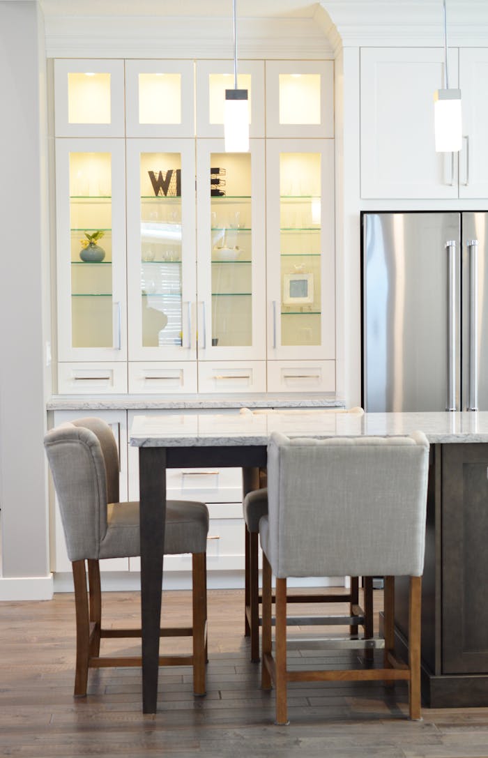 about-01 Clean and contemporary kitchen interior with white cabinets and minimalist decor.